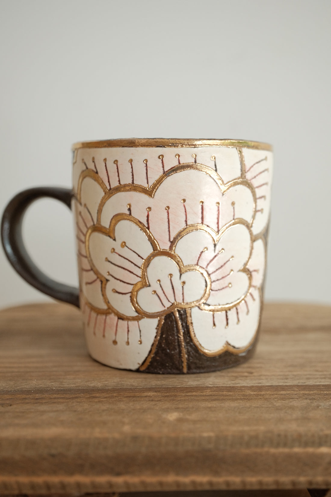 Cool Banana Black Pottery with Gold Detailing Mug - Camellia