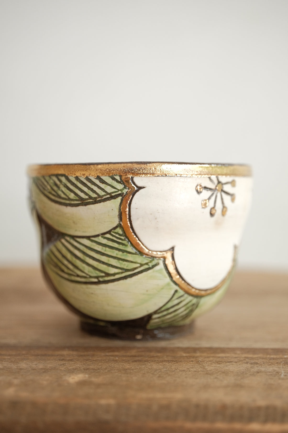 Cool Banana Black Pottery with Gold Detailing Tea Cup