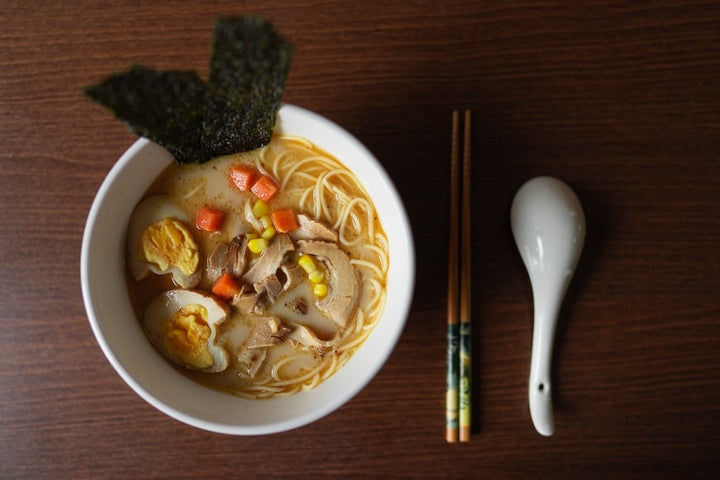 Japanese bowl with soup and garnish